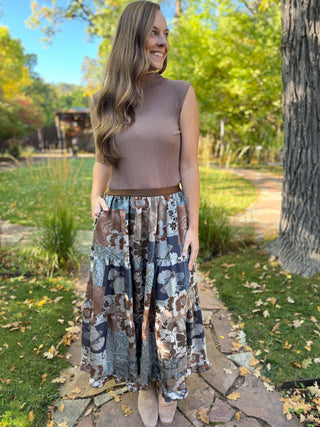 Woman in a blue and brown patchwork floral tiered maxi skirt | V-Rae's Boutique