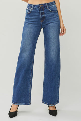 Blue jeans worn by a person on a white background