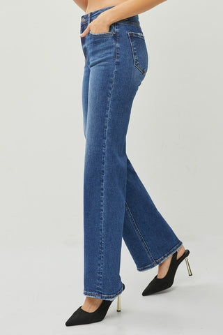 Blue jeans worn by a person on a light gray background