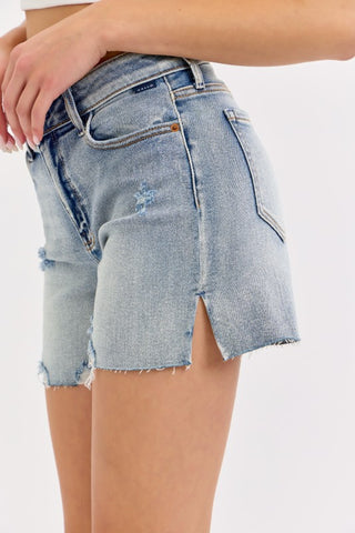 Denim shorts with a distressed look on a white background
