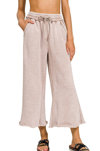 Light brown wide-leg pants with drawstring waist on a white background