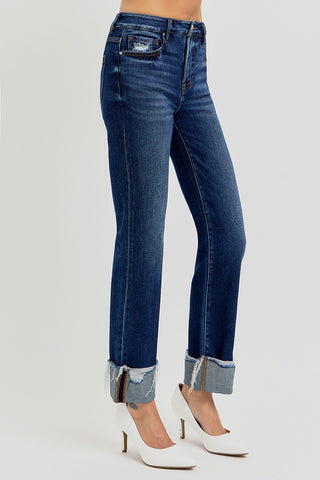 Blue jeans worn by a person on a white background