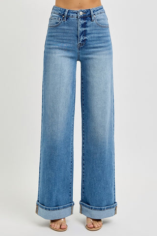 Blue jeans with a light wash on a gray background