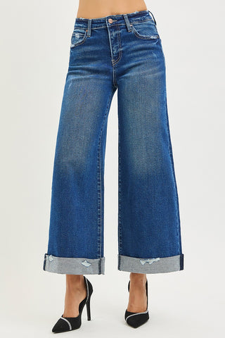 Blue wide-leg jeans on a white background