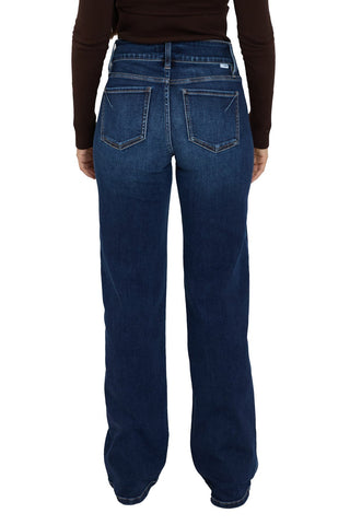 Blue jeans worn by a person on a white background