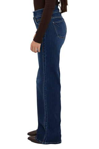 Blue jeans worn by a person on a white background