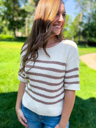 Photo of a woman wearing a sweater.
