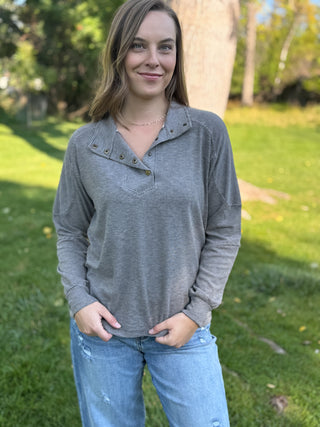 Woman wearing a striped pullover.