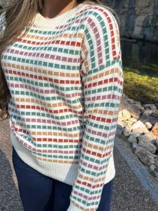 Close-up of the multicolor grid knit pattern on a cream sweater | V-Rae's Boutique