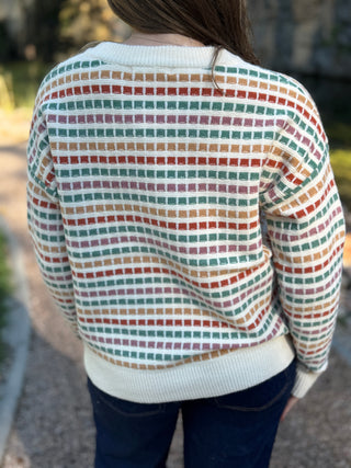 Back view of a cream multicolor grid knit sweater | V-Rae's Boutique