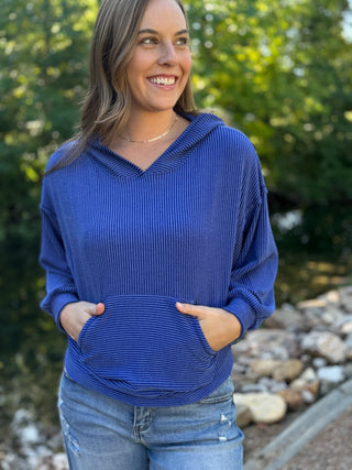 Woman in a royal blue ribbed hoodie with kangaroo pocket and jeans | V-Rae's Boutique