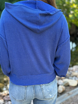 Back view of a royal blue ribbed hoodie with relaxed fit | V-Rae's Boutique