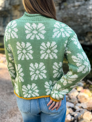 Back view of a sage green daisy print mock neck sweater | V-Rae's Boutique