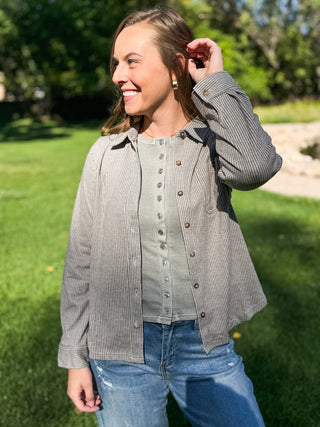Woman in a gray pinstripe button-front shacket over a sage henley and jeans | V-Rae's Boutique