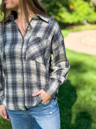 Navy plaid oversized flannel shirt worn with a hand in the jeans pocket | V-Rae's Boutique