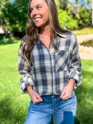 Oversized navy and cream plaid flannel shirt worn untucked with jeans | V-Rae's Boutique