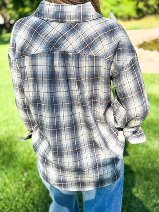 Back view of an oversized navy plaid flannel shirt showing the yoke seam | V-Rae's Boutique