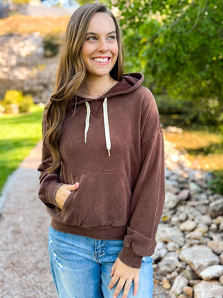 Woman in a brown vintage wash pullover hoodie with cream drawstrings | V-Rae's Boutique
