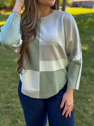 Side view of a color-block batwing sweater with dolman sleeves | V-Rae's Boutique