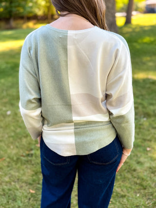 Back view of a sage and cream color-block batwing knit sweater | V-Rae's Boutique