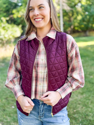 Rose plaid flannel shirt styled under a wine quilted puffer vest | V-Rae's Boutique