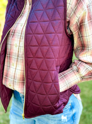 Close-up of the triangle quilting and zip pocket on a wine puffer vest | V-Rae's Boutique