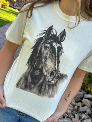 Close-up of the black horse sketch print on a cream graphic tee | V-Rae's Boutique