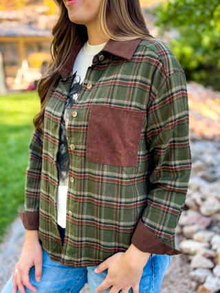 Close-up of the corduroy collar, chest pocket and snap front on a green plaid flannel | V-Rae's Boutique