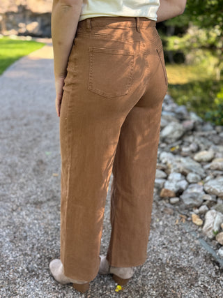 Back view of brown wide leg pants showing patch pockets and raw hem | V-Rae's Boutique