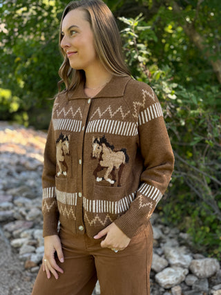 Woman in a brown horse print cardigan with collar and snap front | V-Rae's Boutique