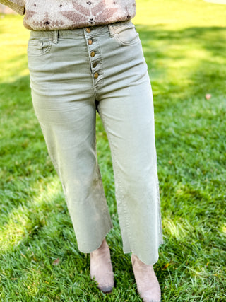 Sage green wide leg button-fly pants with raw hem and ankle boots | V-Rae's Boutique