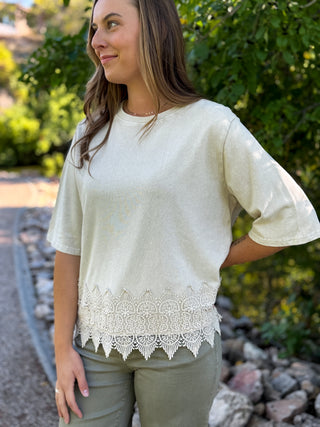 Cream crochet hem top with a relaxed fit, styled with olive pants | V-Rae's Boutique