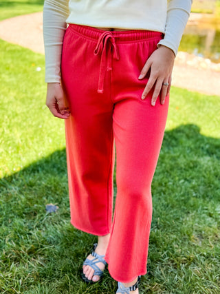 Model wearing a pair of crop sweats.