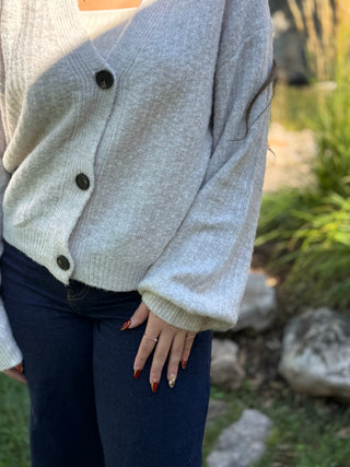 Button front and cuffed balloon sleeve detail on a gray knit cardigan | V-Rae's Boutique