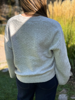 Back view of a gray balloon sleeve cardigan with a relaxed fit | V-Rae's Boutique