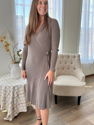 Lady standing featuring a mocha wrap sweater dress.
