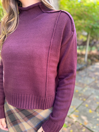 Close-up of the exposed seam detail on a plum cropped sweater | V-Rae's Boutique