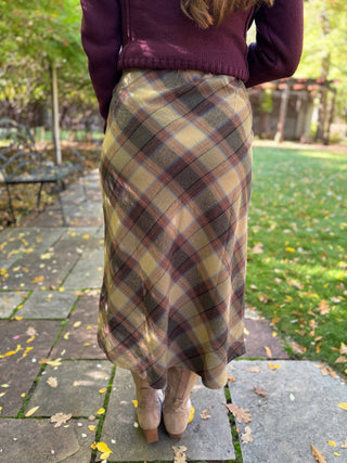 Back view of an olive plaid midi skirt with boots | V-Rae's Boutique