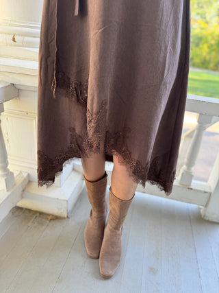 Lace trim hem detail on a brown wrap midi dress | V-Rae's Boutique