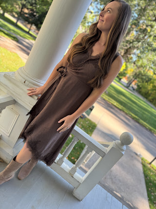 Woman in a brown lace wrap midi dress with tall suede boots | V-Rae's Boutique