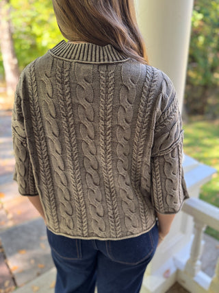 Back view of a charcoal washed cable knit sweater | V-Rae's Boutique