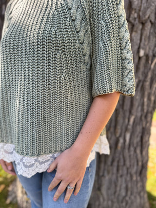 Close-up of the lace trim hem on a sage cable knit sweater | V-Rae's Boutique