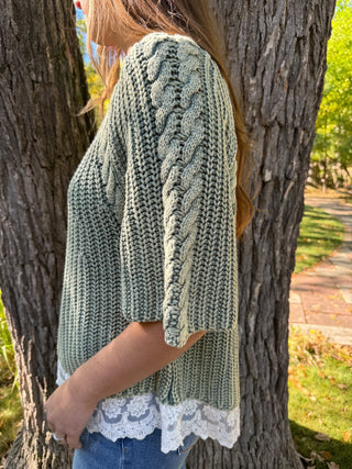 Side view of a sage cable knit sweater showing cable sleeve | V-Rae's Boutique