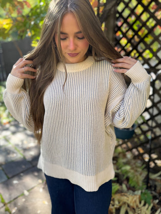 Woman in a cream and gray two tone ribbed crewneck sweater | V-Rae's Boutique
