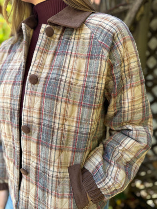 Close-up of the plaid quilting and corduroy trim on a jacket | V-Rae's Boutique