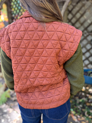 Back view of a rust quilted snap-front utility vest | V-Rae's Boutique