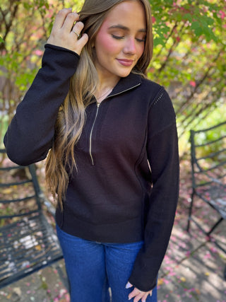 Woman in a black half zip pointelle sweater with jeans | V-Rae's Boutique