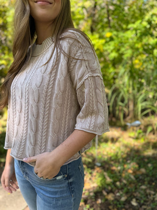 Stone washed cable knit sweater with hand in jeans pocket | V-Rae's Boutique