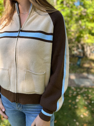 Close-up of the stripes and pockets on a retro zip-up sweater | V-Rae's Boutique