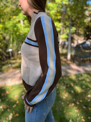 Side view showing the blue sleeve stripe on a retro zip-up sweater | V-Rae's Boutique
